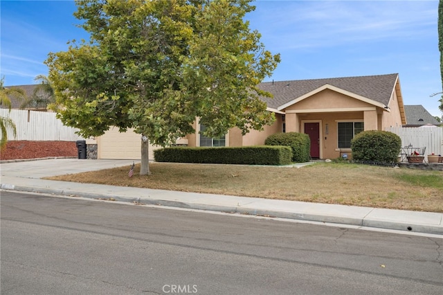 view of front of home with a front lawn and a garage