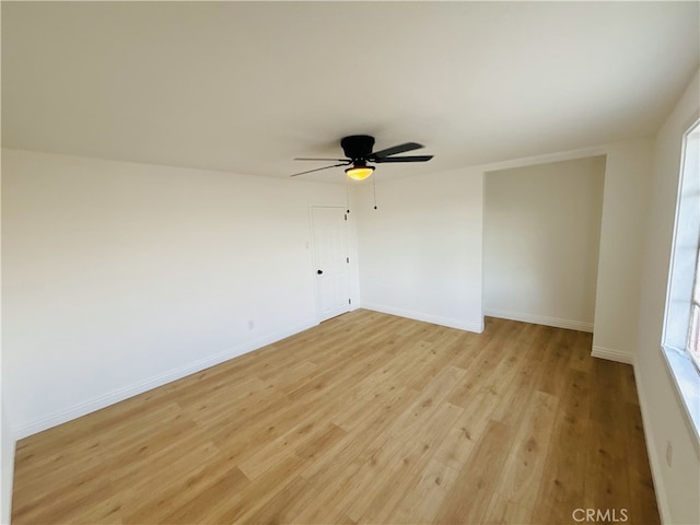 unfurnished room with light hardwood / wood-style floors and ceiling fan