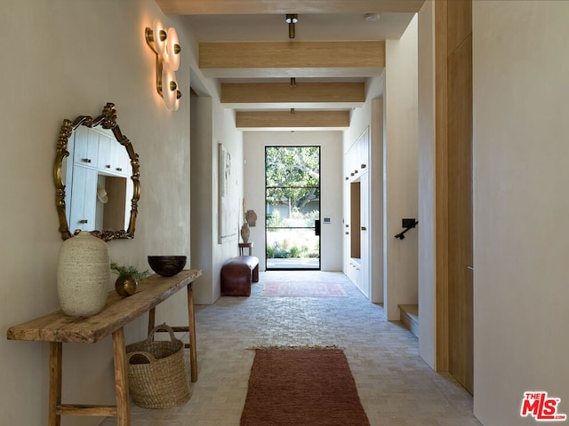 entryway with beam ceiling