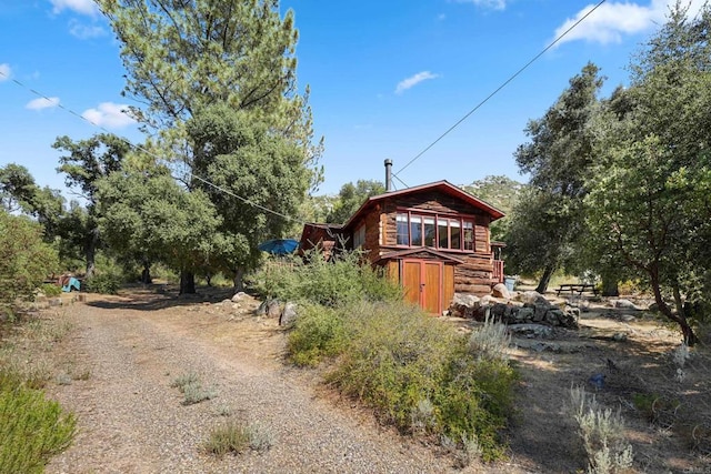 view of home's exterior featuring a rural view