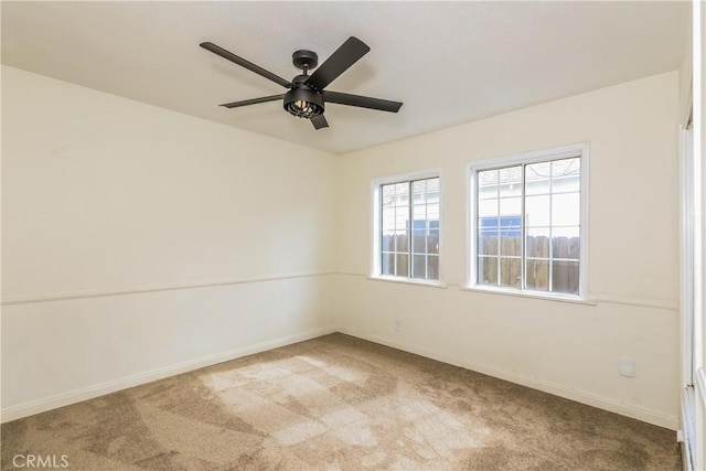 empty room with light carpet and ceiling fan