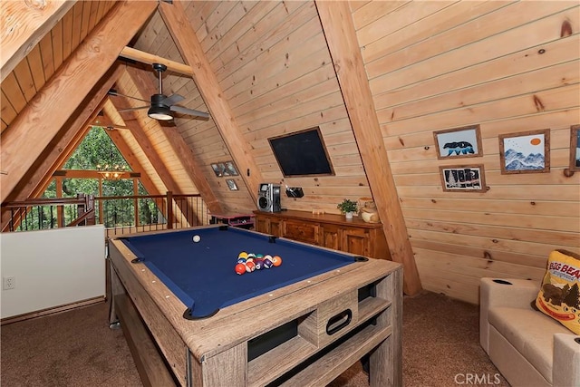 playroom featuring lofted ceiling with beams, wooden walls, and carpet flooring