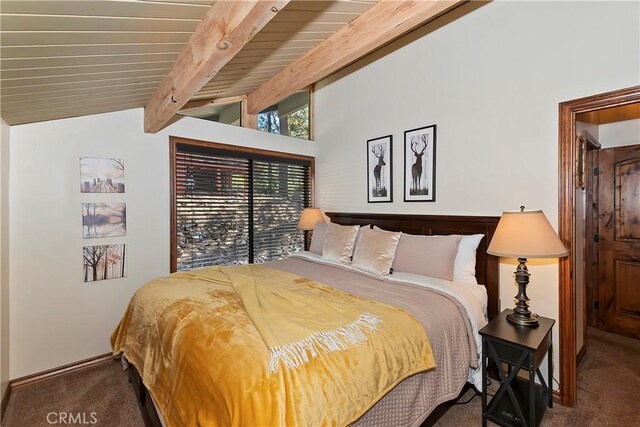 bedroom with vaulted ceiling with beams, dark colored carpet, and wooden ceiling