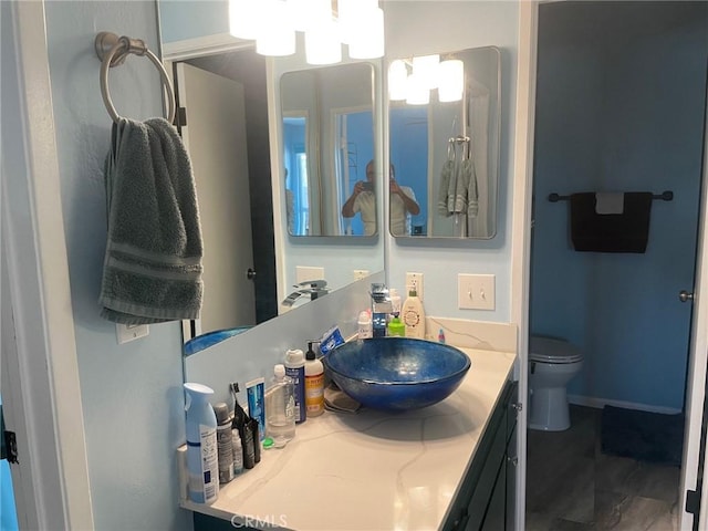 bathroom with vanity and toilet