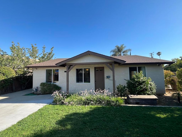 ranch-style house with a front lawn