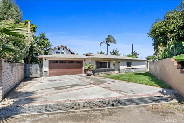 ranch-style house with a garage and a front lawn