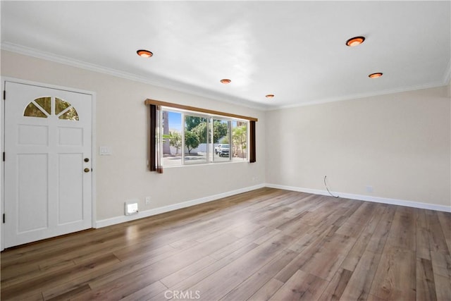 entrance foyer featuring hardwood / wood-style flooring and ornamental molding