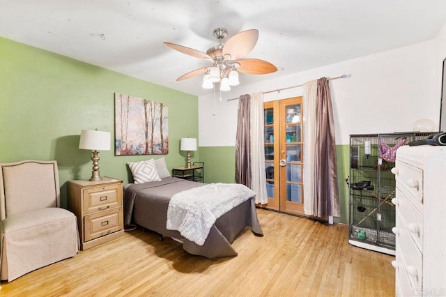 bedroom with ceiling fan and light hardwood / wood-style flooring