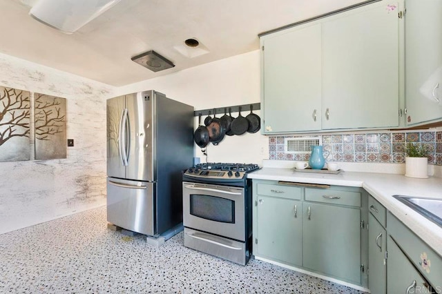 kitchen featuring tasteful backsplash and appliances with stainless steel finishes