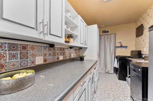 kitchen with sink, white cabinetry, decorative backsplash, and black appliances