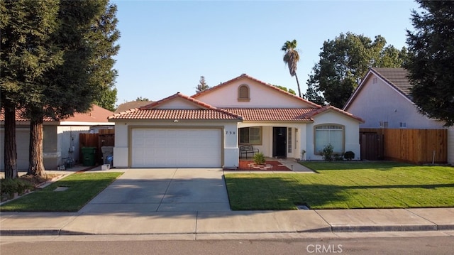 view of front of property featuring a front lawn and a garage