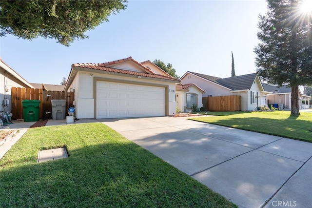 view of front facade featuring a front yard and a garage