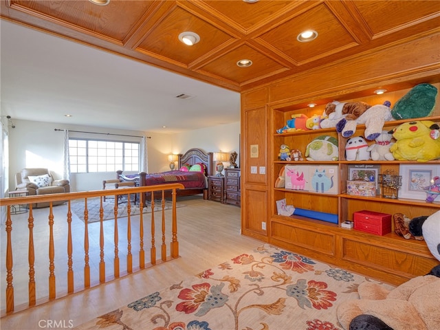 bedroom with beamed ceiling, wood ceiling, ornamental molding, coffered ceiling, and light hardwood / wood-style floors