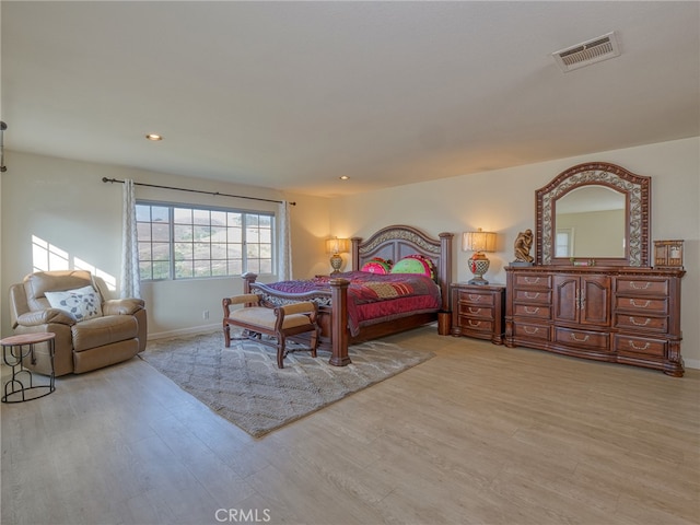 bedroom with light hardwood / wood-style floors