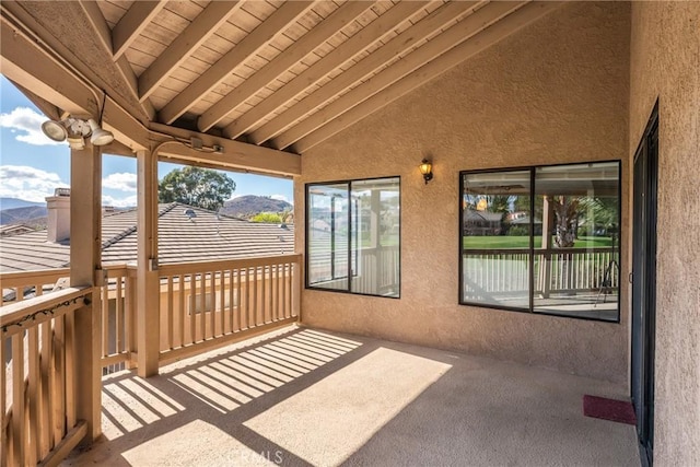 view of patio / terrace featuring a mountain view and a balcony