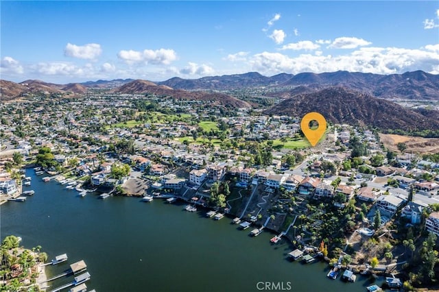 birds eye view of property featuring a water and mountain view