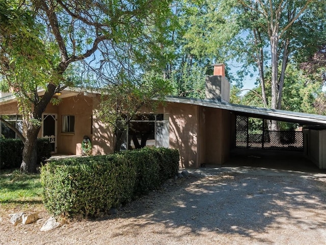 exterior space featuring a carport