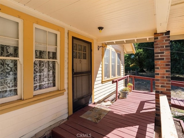 wooden deck featuring covered porch