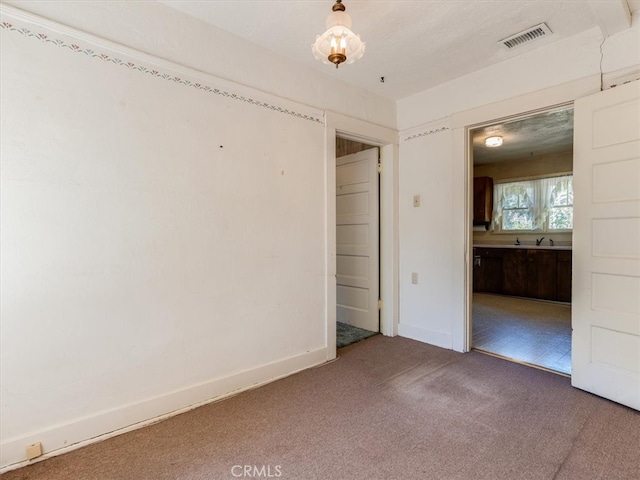 view of carpeted spare room