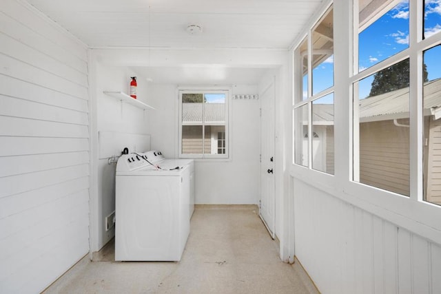 clothes washing area featuring washing machine and dryer