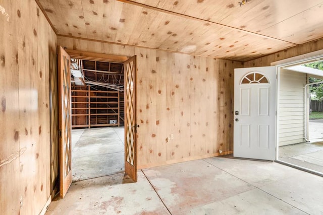 interior space featuring wooden walls