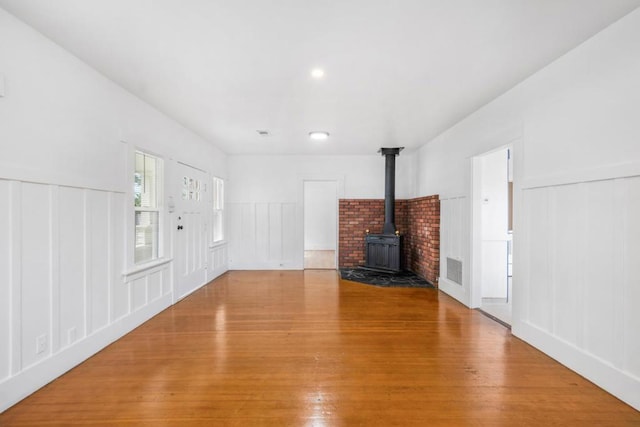 unfurnished living room featuring hardwood / wood-style flooring