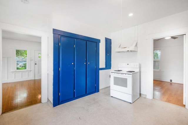 kitchen featuring ceiling fan, white cabinets, white electric stove, and light hardwood / wood-style floors