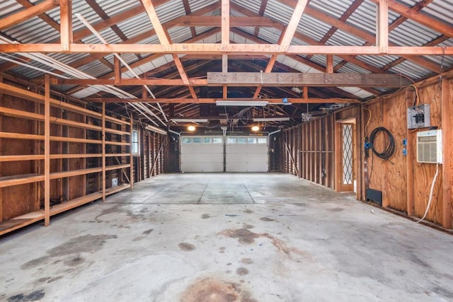 garage with a wall mounted air conditioner