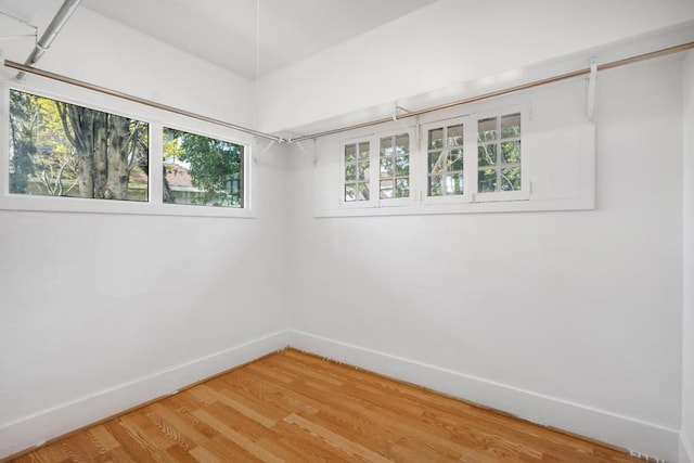 unfurnished room featuring wood-type flooring