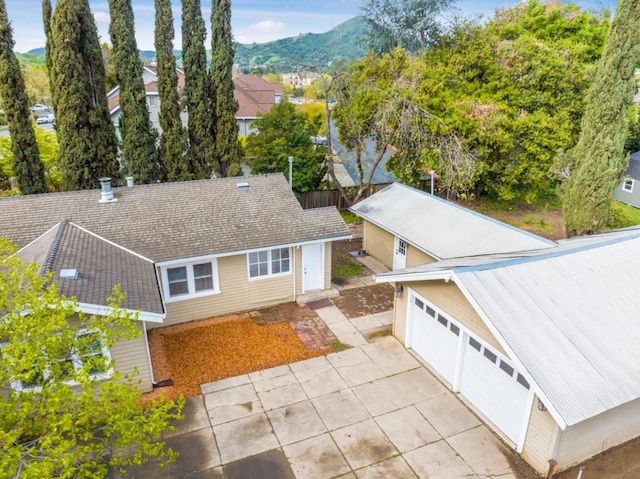 birds eye view of property with a mountain view