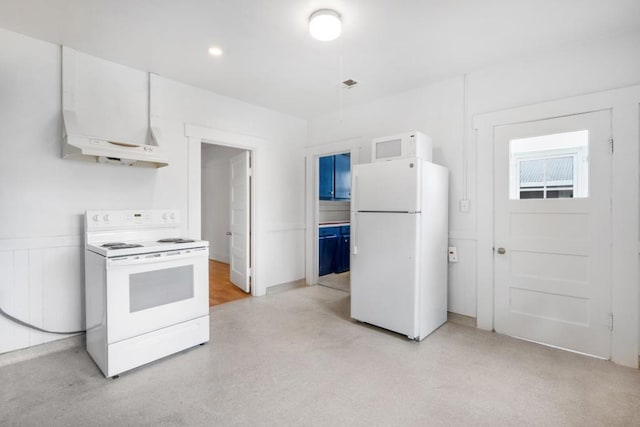 kitchen featuring white appliances and white cabinetry