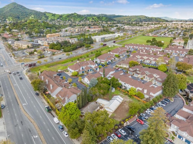 birds eye view of property with a mountain view