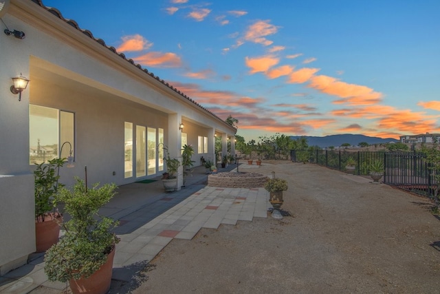 patio terrace at dusk with a mountain view