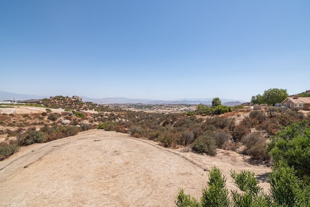 birds eye view of property featuring a mountain view