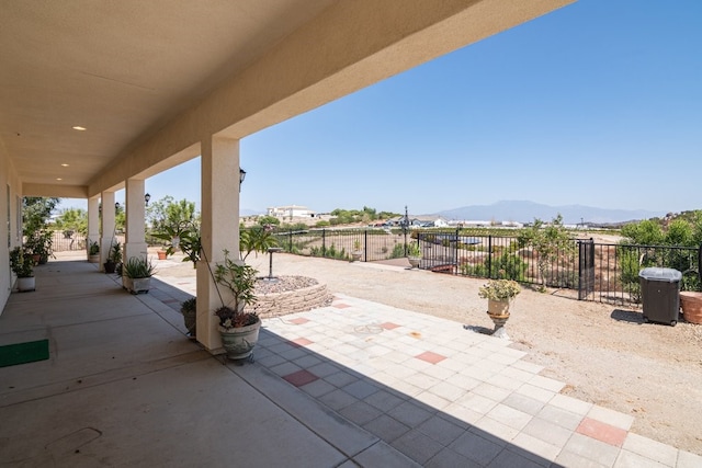 view of patio / terrace featuring a mountain view