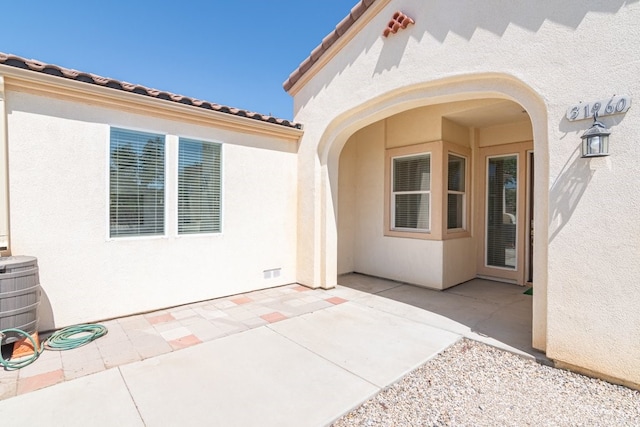 property entrance with a patio area