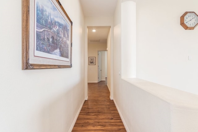 hall with dark wood-type flooring