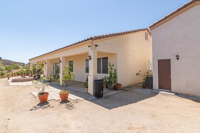 rear view of property with a patio