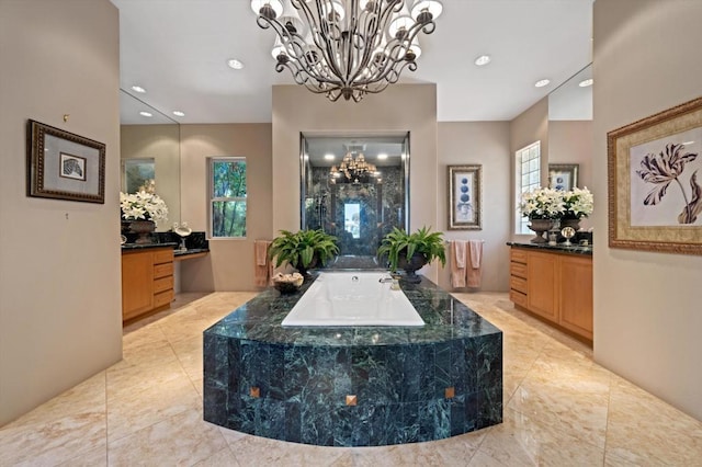 bathroom with a tub and vanity