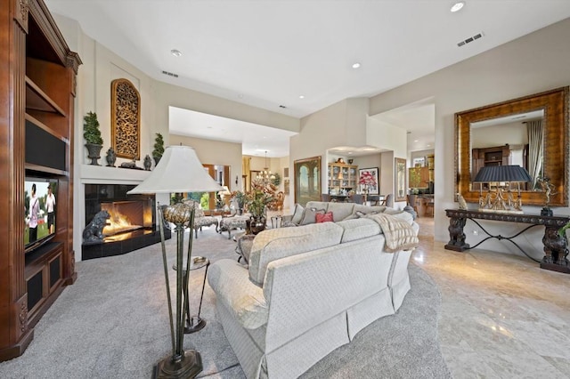 living room with a tile fireplace