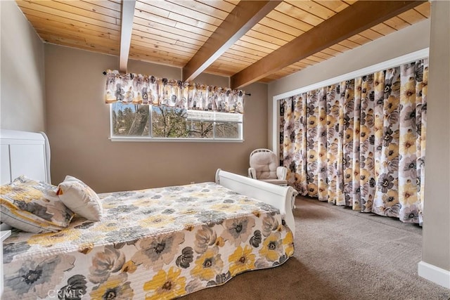 carpeted bedroom with beam ceiling and wood ceiling