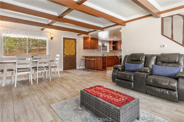 living room featuring sink, coffered ceiling, light hardwood / wood-style flooring, beamed ceiling, and crown molding