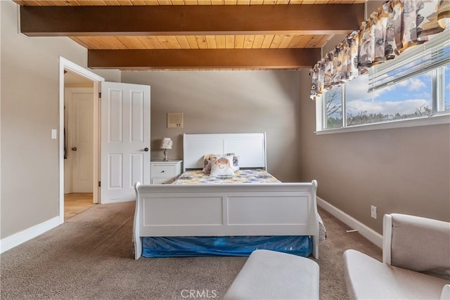 carpeted bedroom featuring beam ceiling, multiple windows, and wood ceiling