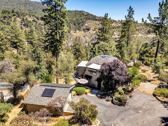 birds eye view of property with a mountain view