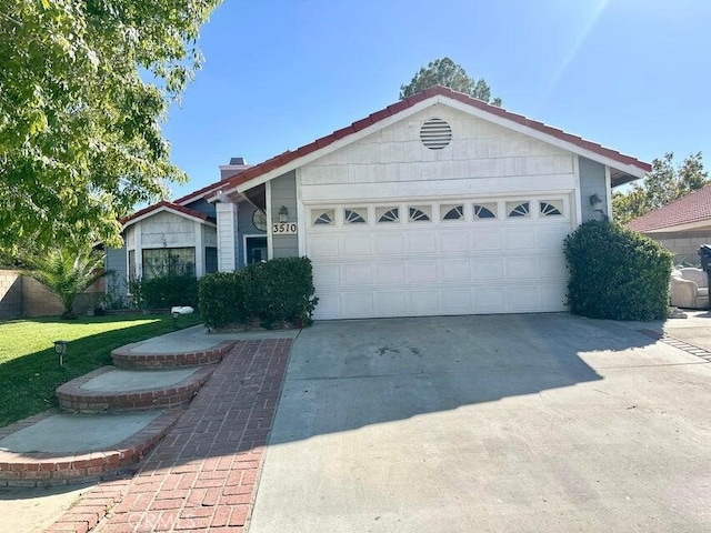 ranch-style home featuring a garage