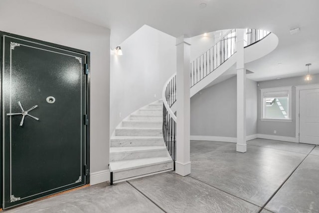 foyer entrance featuring concrete flooring