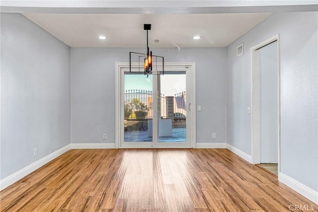 unfurnished dining area with light hardwood / wood-style flooring