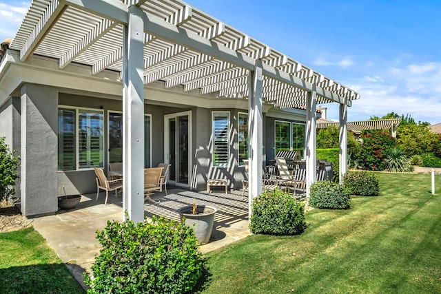 back of house featuring a pergola, a yard, and a patio