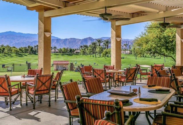 view of patio / terrace featuring a mountain view, a pergola, and ceiling fan