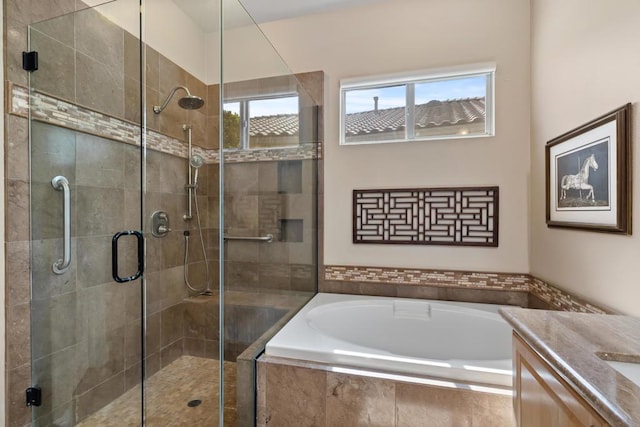 bathroom featuring vanity and separate shower and tub